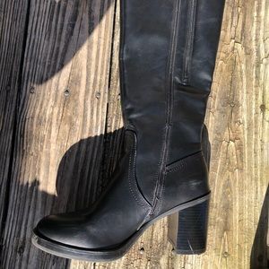 Black high, below the knees leather boots